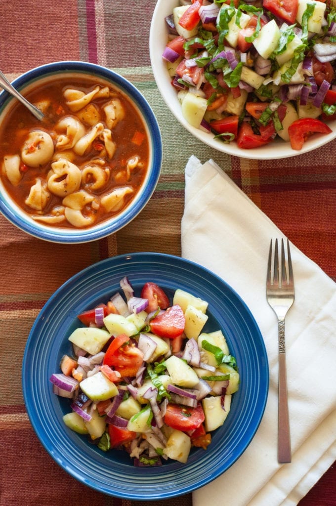 Pictured is the first salad and soup combination we are going to make, a cold cucumber and tomato salad with tortellini soup.