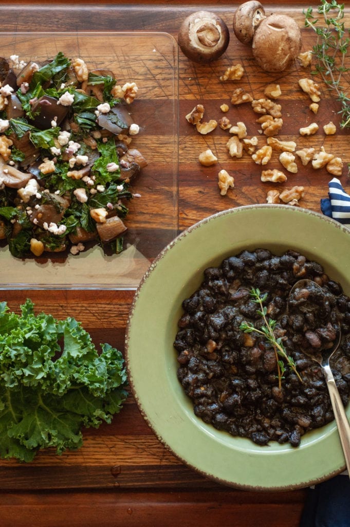 This depicts the second salad and soup combo. Our Shoshone Black Bean Soup and a warm kale and eggplant salad.