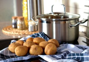 Potatoes in front of a stockpot